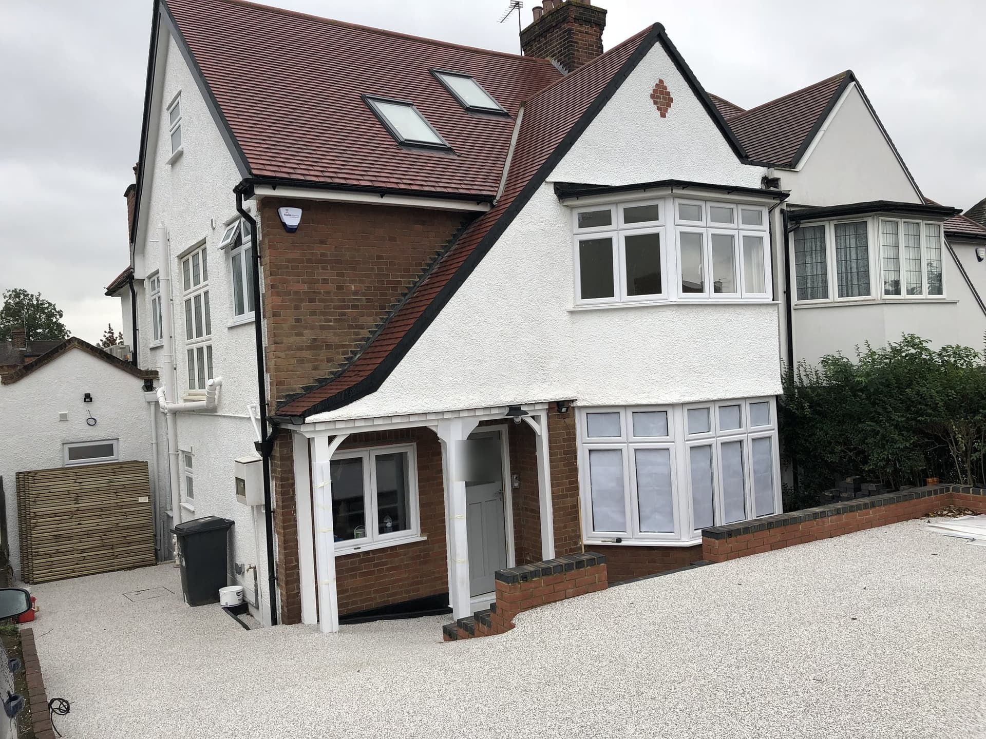 Front of the renovated house in Basing Hill, Hampstead, with a resin-bound driveway